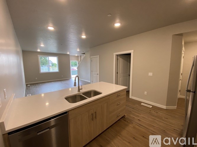 A kitchen with a sink and a window.