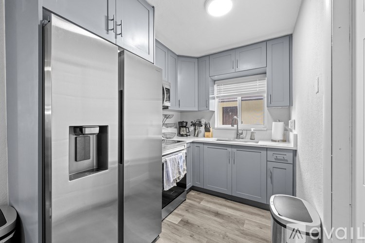 A dining table set with plates, glasses, and cutlery is ready for a meal.