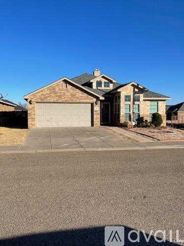 A house with a garage is for sale.