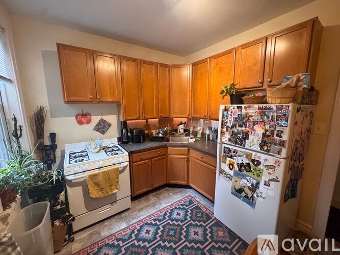A kitchen with a stove, oven, and microwave.
