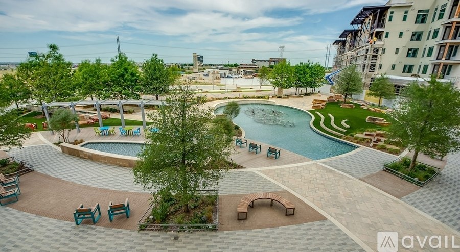 A pool surrounded by trees and chairs with the words "Family Sampler" written on the side.