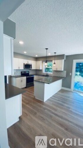 A modern kitchen with a large island in the middle.