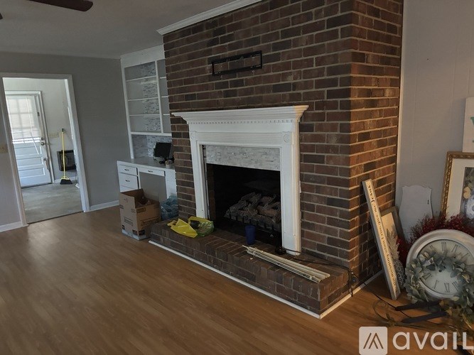 A fireplace with a clock on the side.