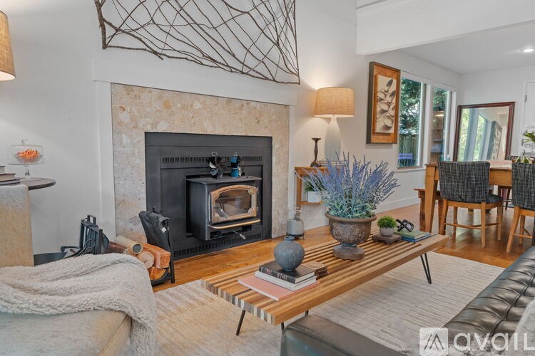 A living room with a fireplace and a couch.