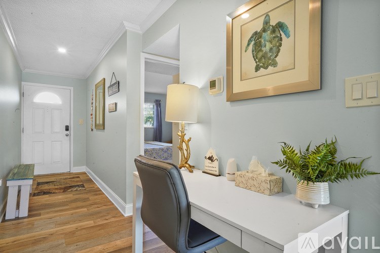 A room with a desk and a chair.