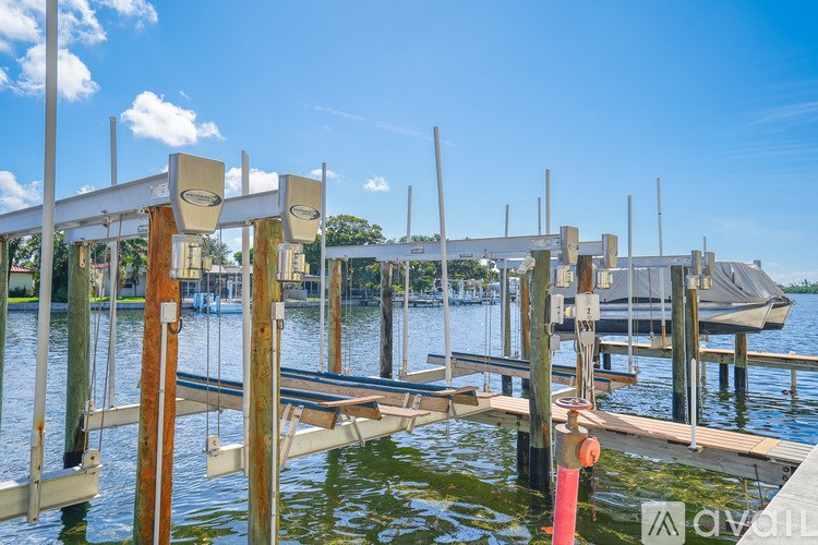 A dock with a boat in the background.