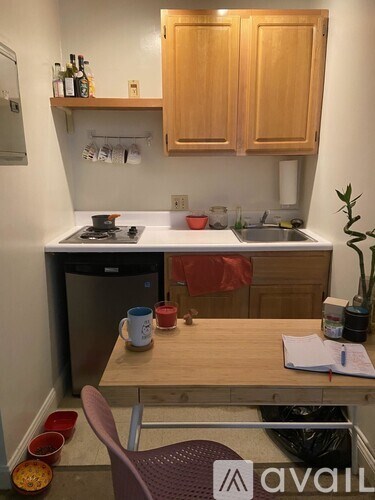 A small kitchen with a table and a chair.