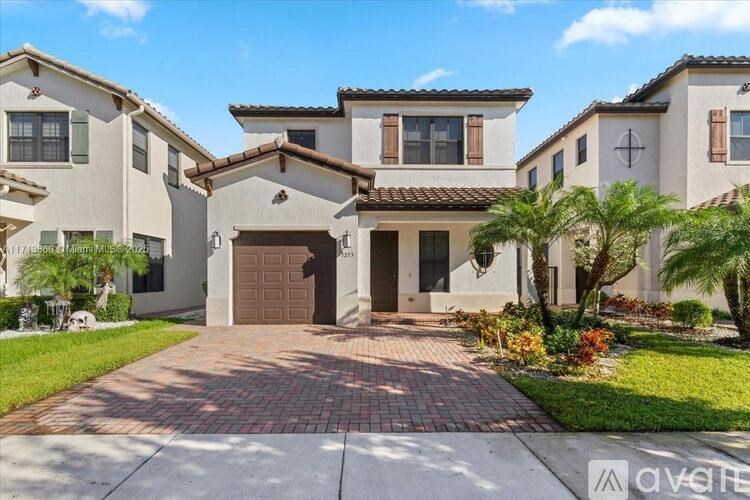 A house with a brown garage door is for sale.