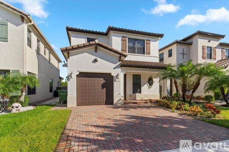 A house with a brown garage door is for sale.