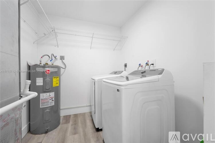 A laundry room with a washer and dryer.