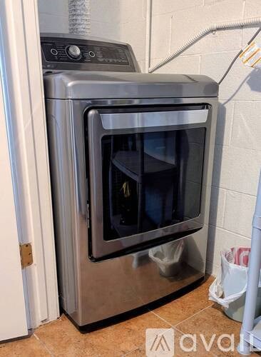 A stainless steel oven with a glass door is in a kitchen.