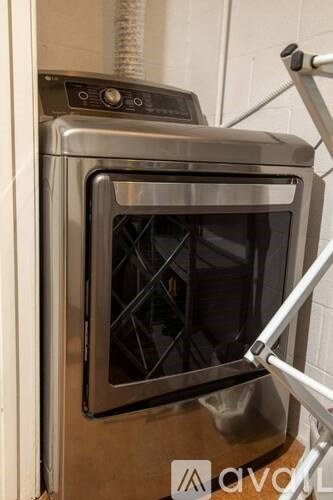 A stainless steel oven with a glass door and control panel.