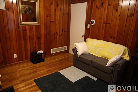 A living room with a couch and a small table.