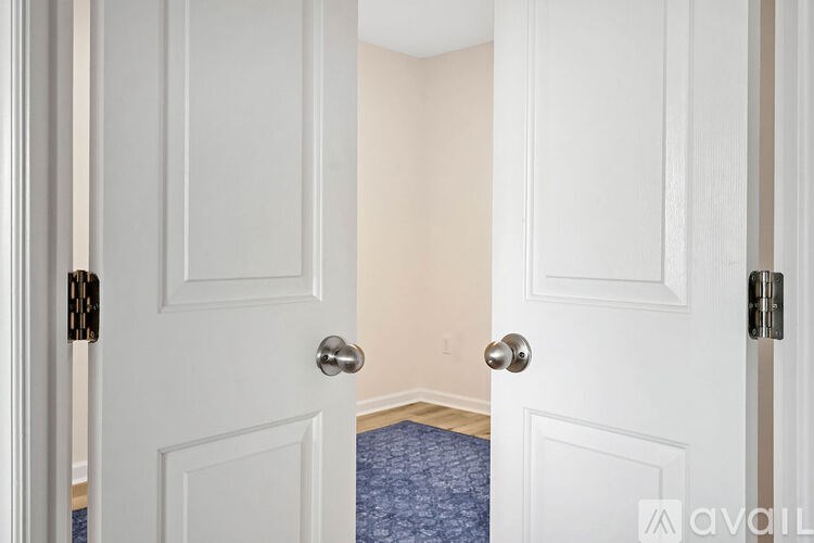 A hallway with two doors on either side.