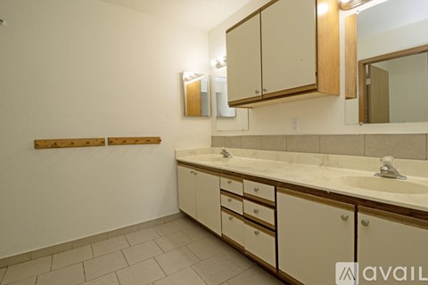 A room with a tiled floor and a wall.
