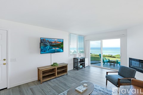 A living room with a wooden bench and a painting on the wall.