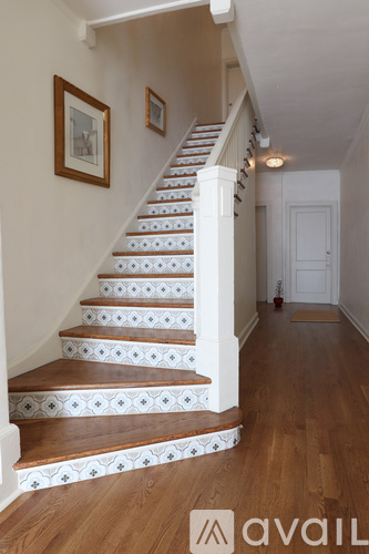 A staircase with a white and brown tile pattern.
