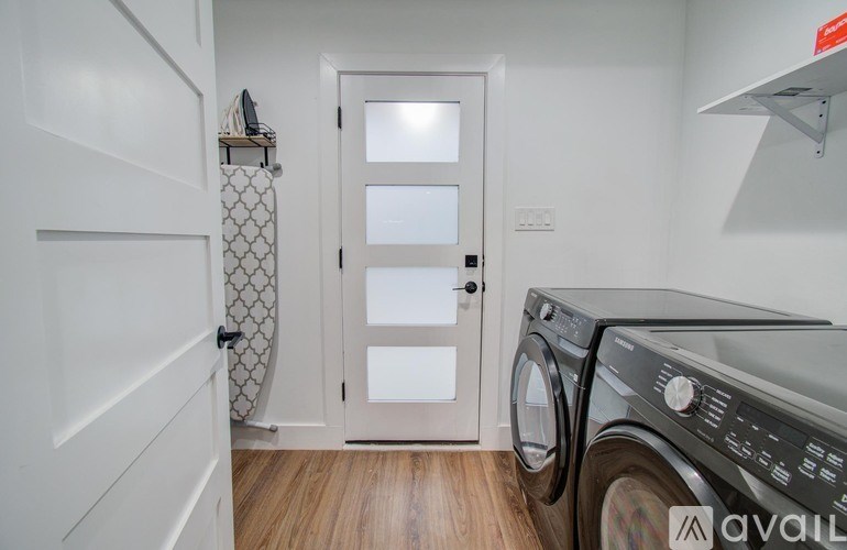 A laundry room with a washer and dryer.