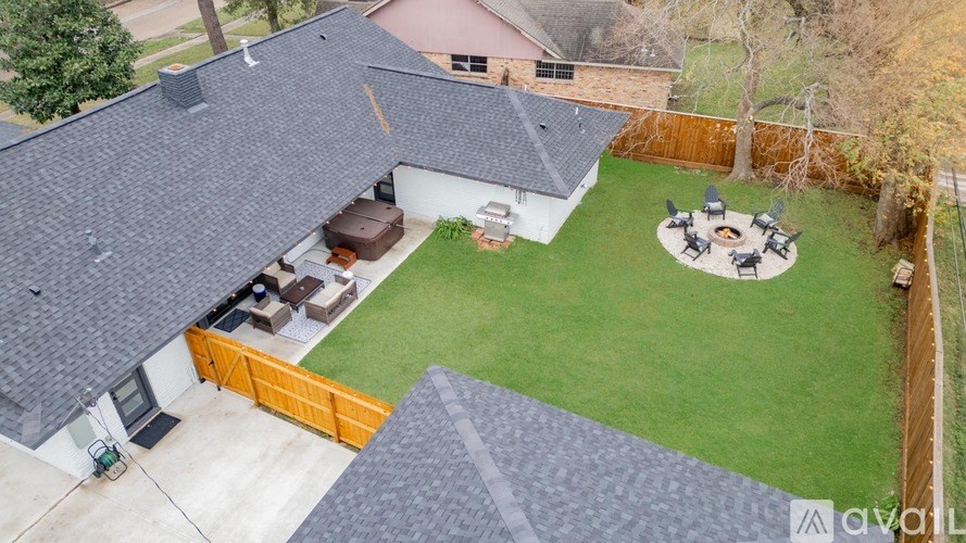 A house with a backyard and a patio.