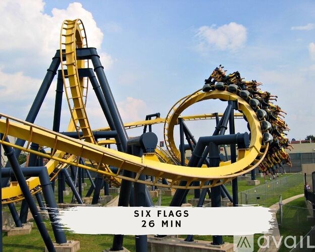 A roller coaster with the text "SIX FLAGS 26 MIN" on it.