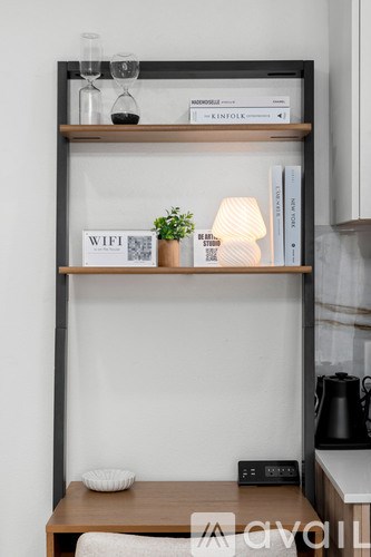 A shelf with a sign that says WIFI and a small potted plant on it.