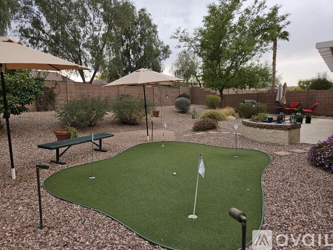 A small putting green in a backyard.