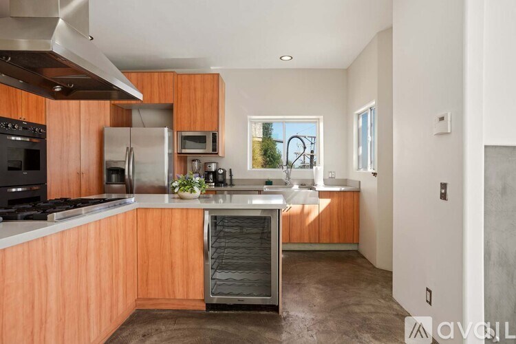 A modern living room with a fireplace and a view of the city.