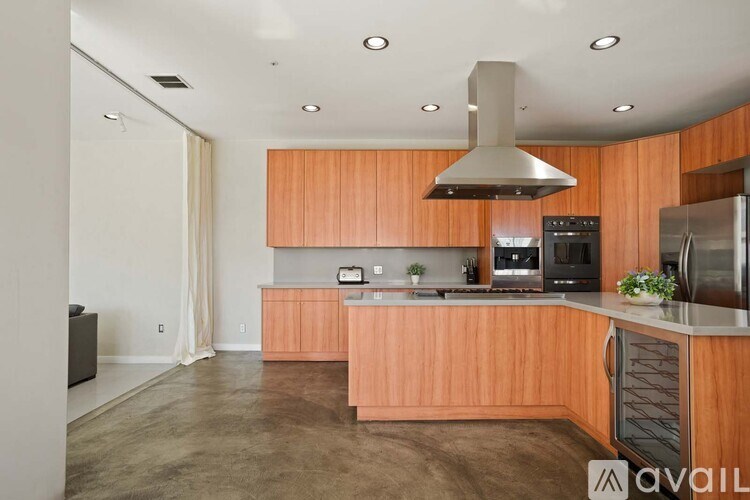 A room with a zebra rug and a tv on the wall.