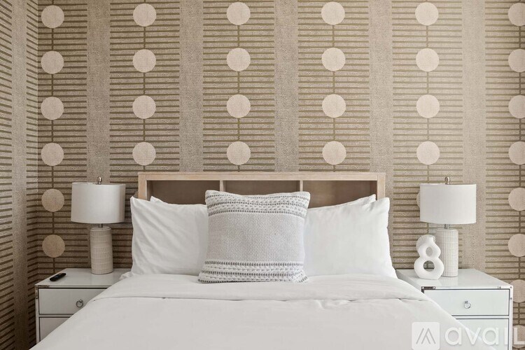 A modern living room with a glass door and a staircase.