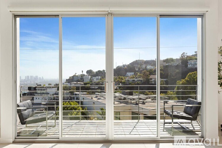 A cityscape with buildings and a clear sky.
