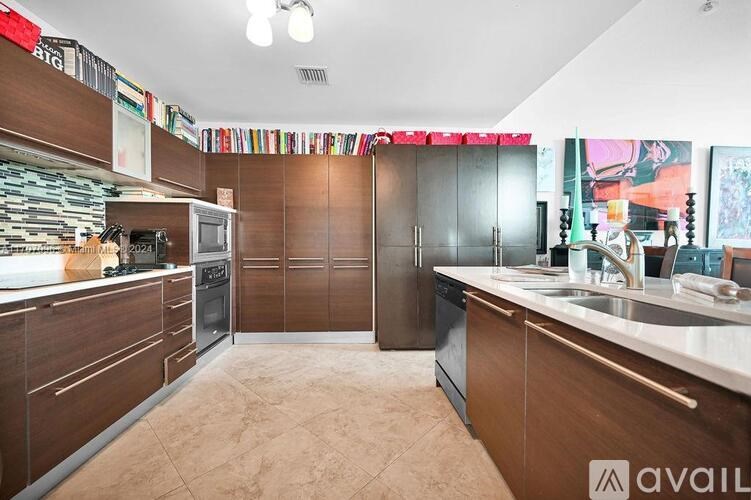 A kitchen with brown cabinets and a white counter.