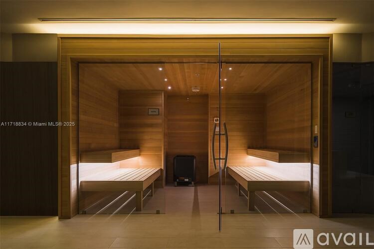 A room with a sauna and two benches.