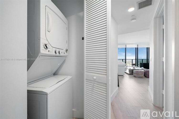 A white oven and dishwasher in a modern kitchen.