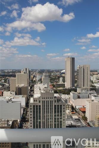 A cityscape with tall buildings and a clear sky.