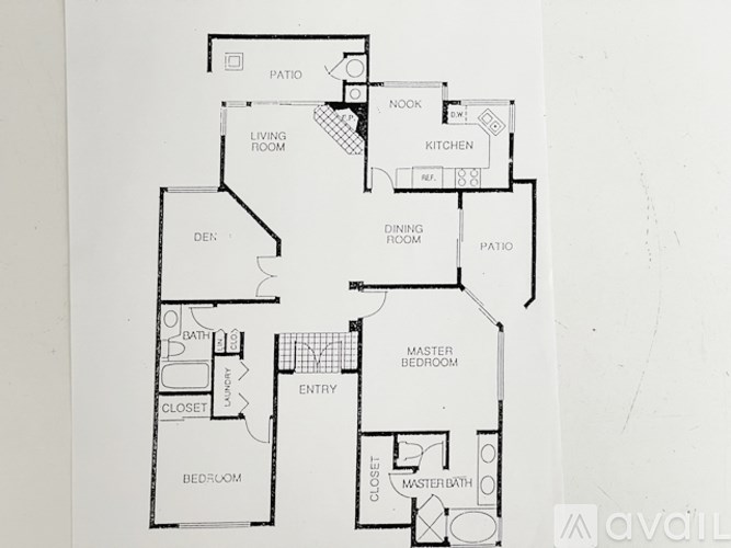 A floor plan of a house with a living room, kitchen, dining room, and bedrooms.