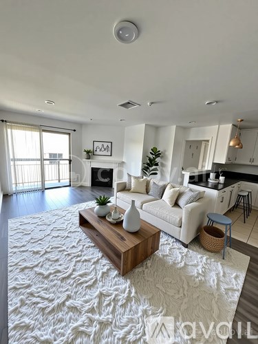 A living room with a white couch and a coffee table.