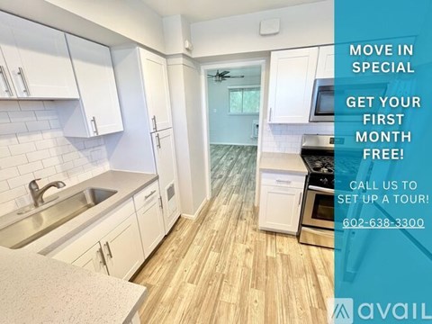 A kitchen with white cabinets and a wooden floor is on sale for a special offer.