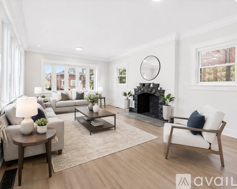 A spacious room with a window and a door.