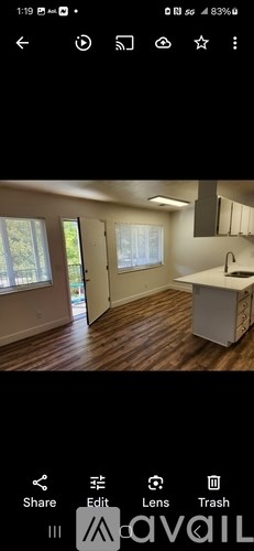 A kitchen with a sink and cabinets is shown.
