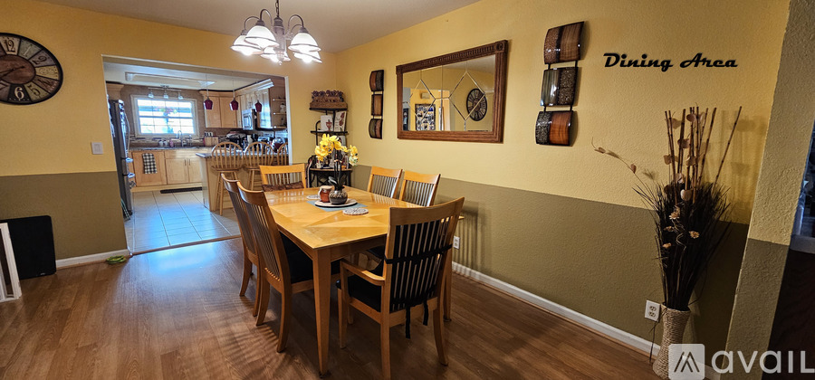 A dining area with a table and chairs.