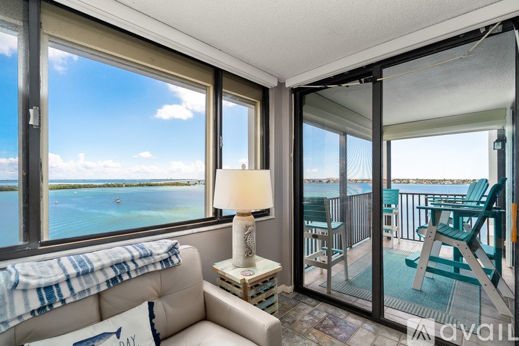 A dining room with a wooden table and chairs.