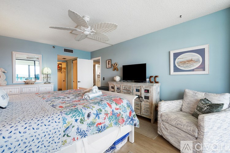 A bathroom with a vanity, mirror, and a white door.