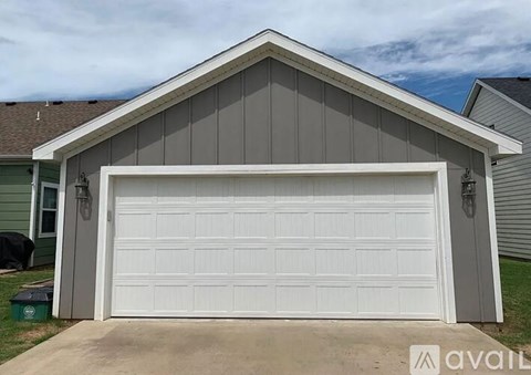 A large white garage door is closed.