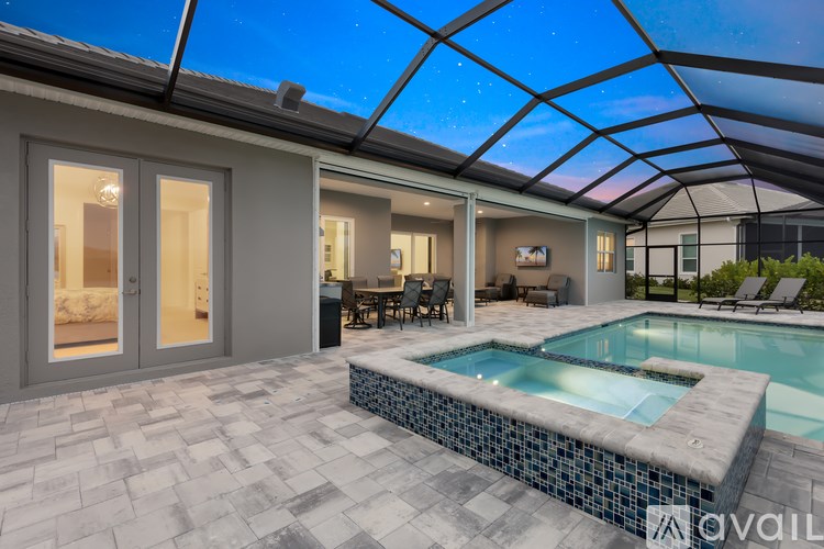 A modern house with a pool in the backyard.