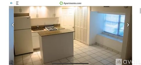 A kitchen with a refrigerator, stove, and sink.