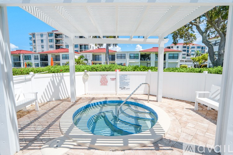 A small pool under a white canopy.