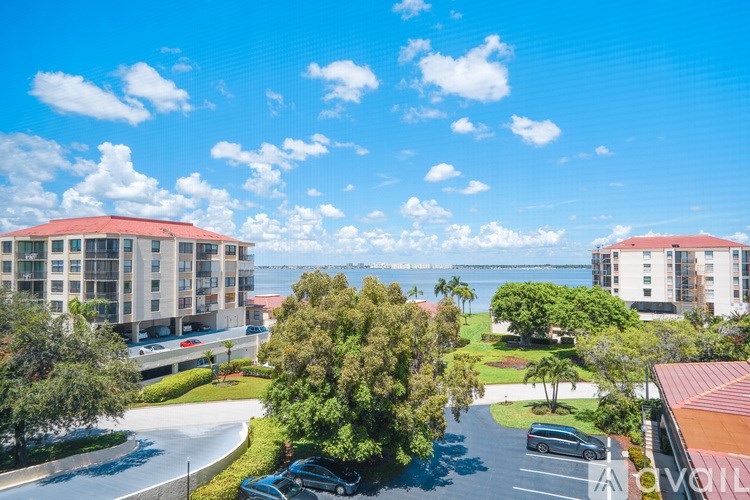A view of a resort with a car parked in front of it.