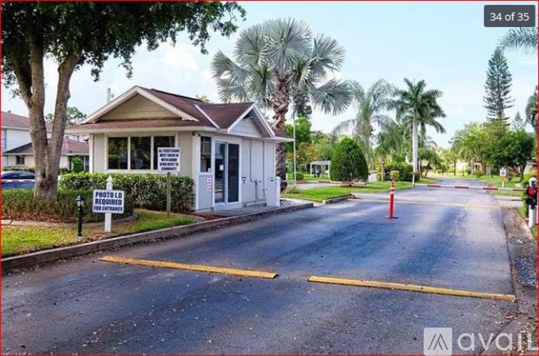 A house with a sign in front of it.