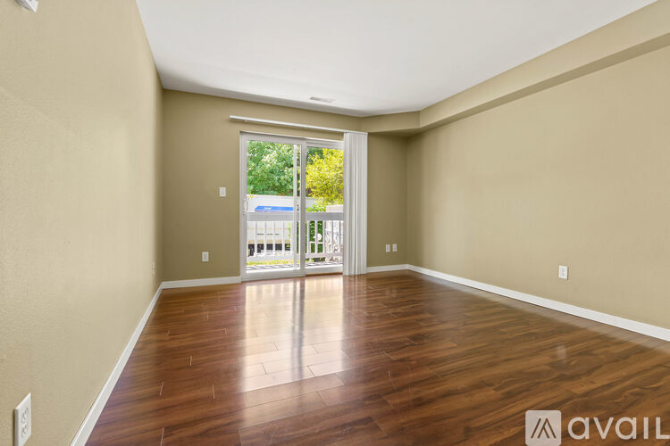 A kitchen with a refrigerator, microwave, and oven is available for rent.