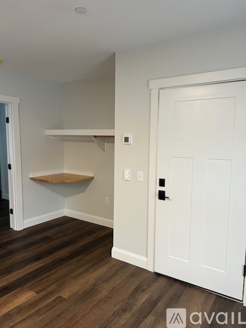 A white door is on the right side of the image.